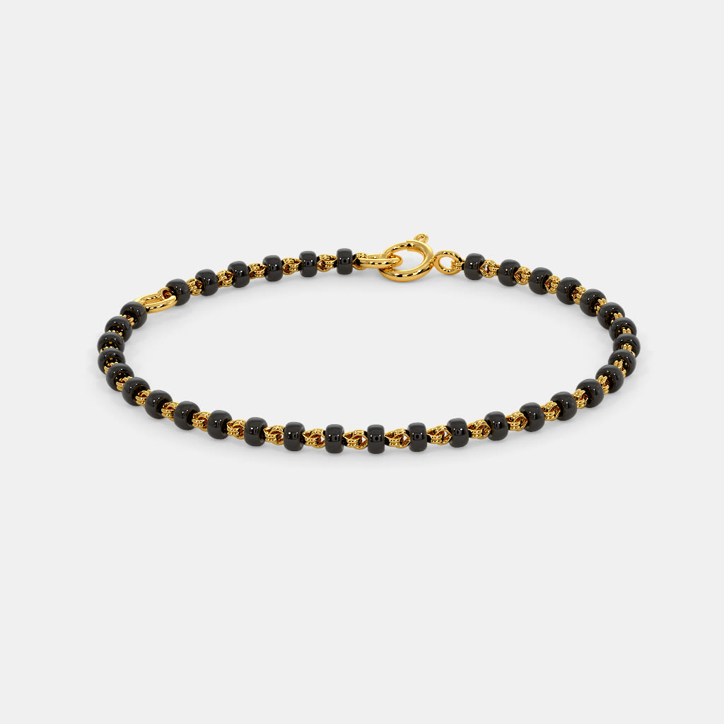 Gold baby bracelet hot sale with black beads